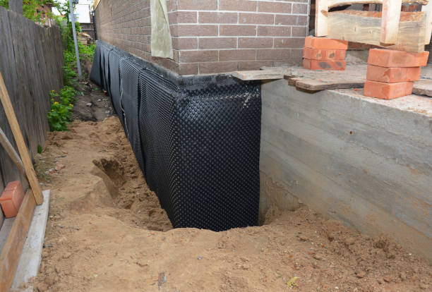 Happy homeowners after waterproofing job in Newfane
